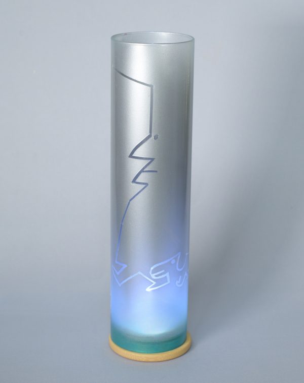 Lamp shown with flood lit backdrop displaying face view.