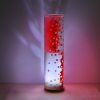 Shown on a display shelf with its LED illuminated, lamp displays brilliant patterns of light.