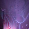 Shown on a display shelf displaying brilliant projected color images on backdrop using its internal LED.