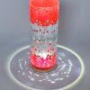 Lamp shown under spot light set directly overhead. Photo displays marvelous projected patterns of light and shadow surrounding base of lamp.