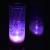 Lit only by its LED, lamp shown set on reflective black plexiglass and also as a side backdrop, lamp displays duel brilliant mirrored images.