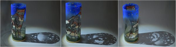 Unique art glass lamp flood lit in three stages of rotation arranged in a triptych