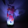 Shown with its LED illuminated lamp displays brilliant patterns of light. Here, displayed is the bird projected from the front onto the rear surface
