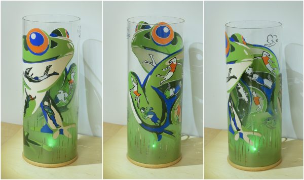 Three alternate flood lit views of lamp are arranged in a triptych.