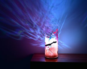 Shown on a display shelf with its LED illuminated lamp displays brilliant patterns of light.