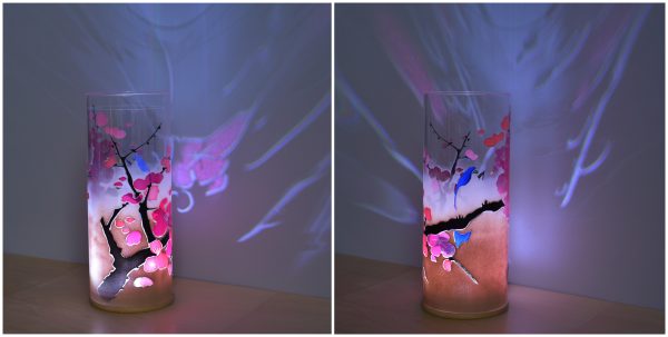 With internal color-changing LED highlighting graphic strength of this lamp. Shown front and back views.