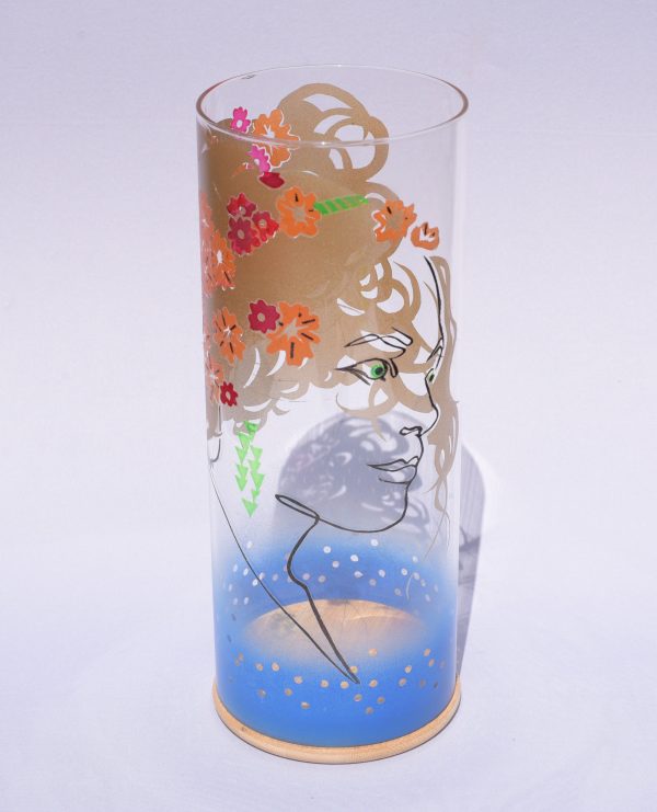 Lamp shown with flood lit backdrop displaying face view. Notice striking overlap between images displayed on front and rear.