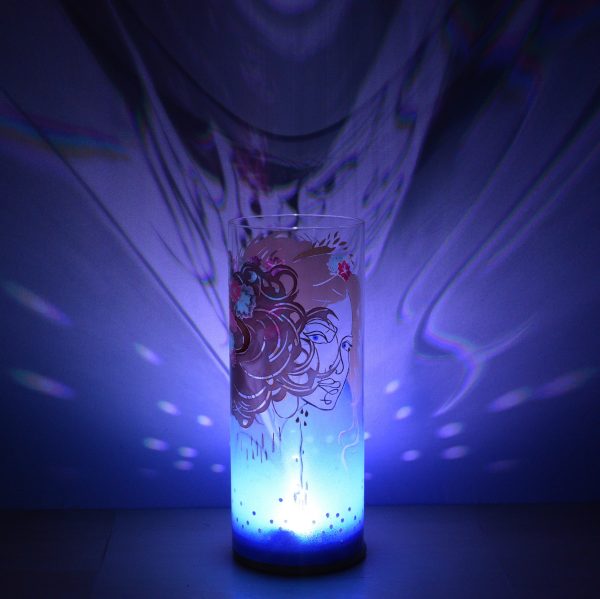 Shown with only LED. Unique art glass lamp displays brilliant shadow patterns on backdrop. View C