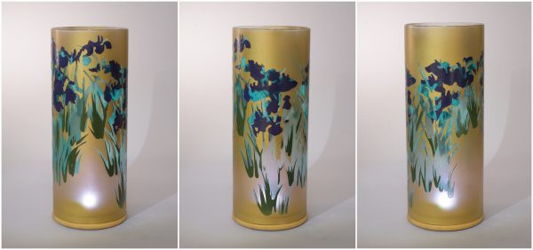 Lit by natural sun light, views of unique art glass lamp show at three stages of rotation here arranged in a triptych.