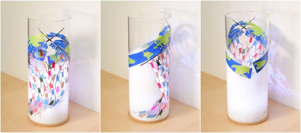 Anje Rozan unique art glass lamp shown lit in three stages of rotation arranged in a triptych.