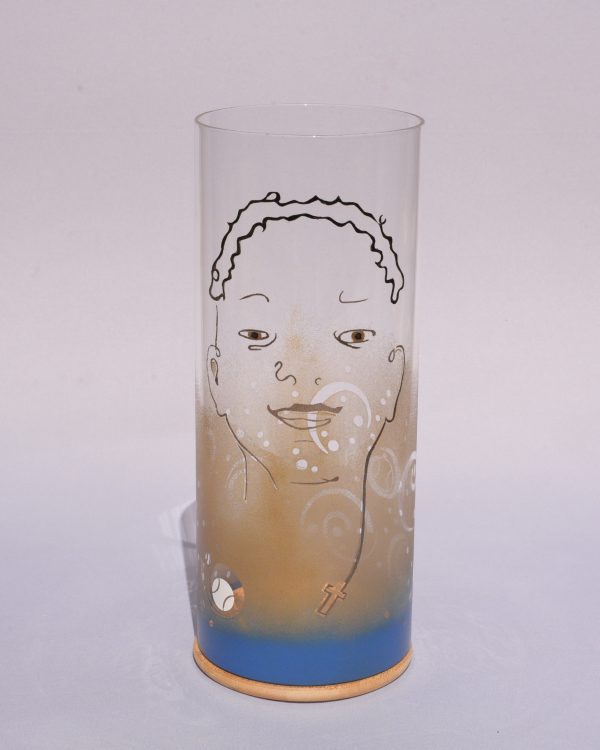 Unique art glass Lamp shown lit by full sun, front view.