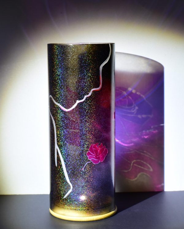 Art glass lamp shown under flood light. Photo emphasizes the transparent colors and the superimposition of forms which transform the image.