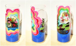 Sky Divers Trip Art glass lamp lit by the LED shown in three stages of rotation arranged in a triptych.