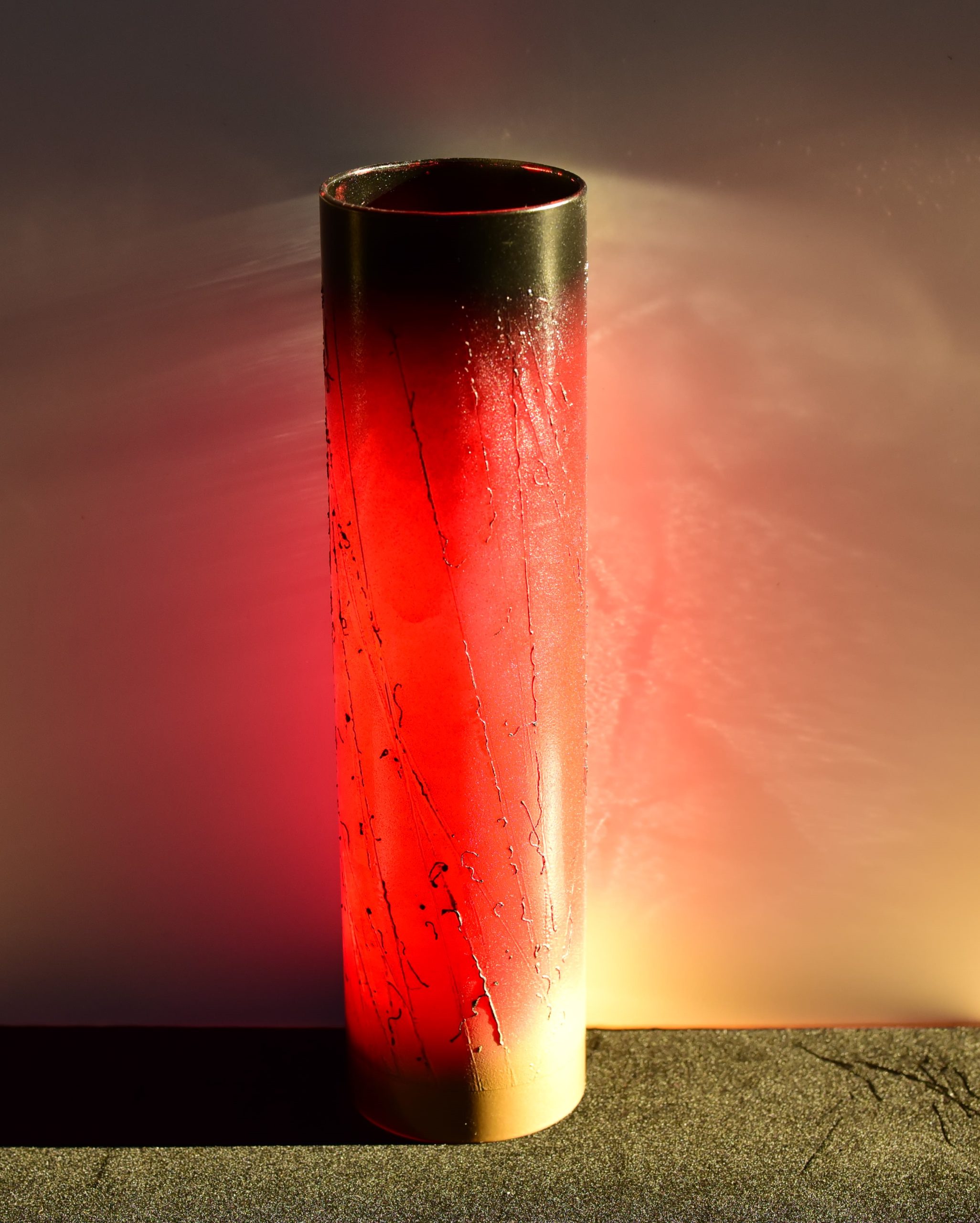 Displayed at sunrise where amber hues of dawn are reflected upon backdrop.