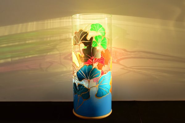 At sunrise, lit from only one side showing projected images on backdrop.