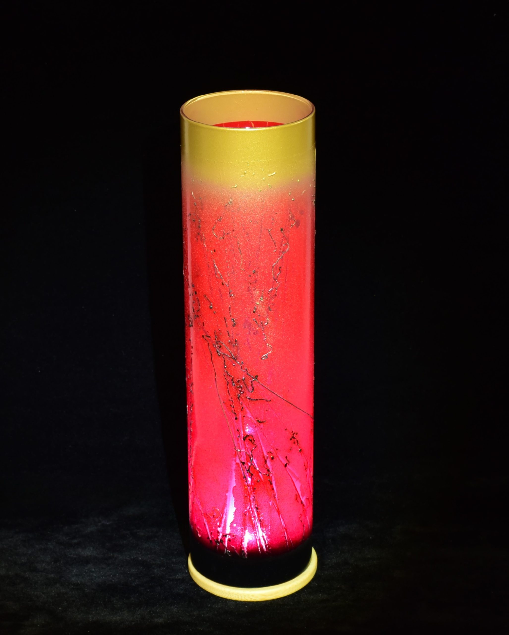 Art glass lamp with LED illuminated shown against black felt backdrop.