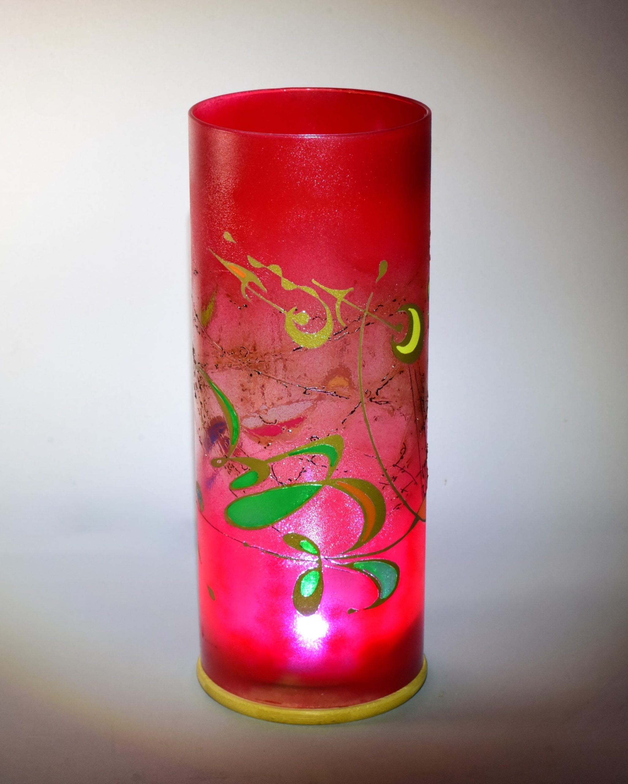 Unique accent lamp shown under spot light displaying transposed views of front and rear of lamp.