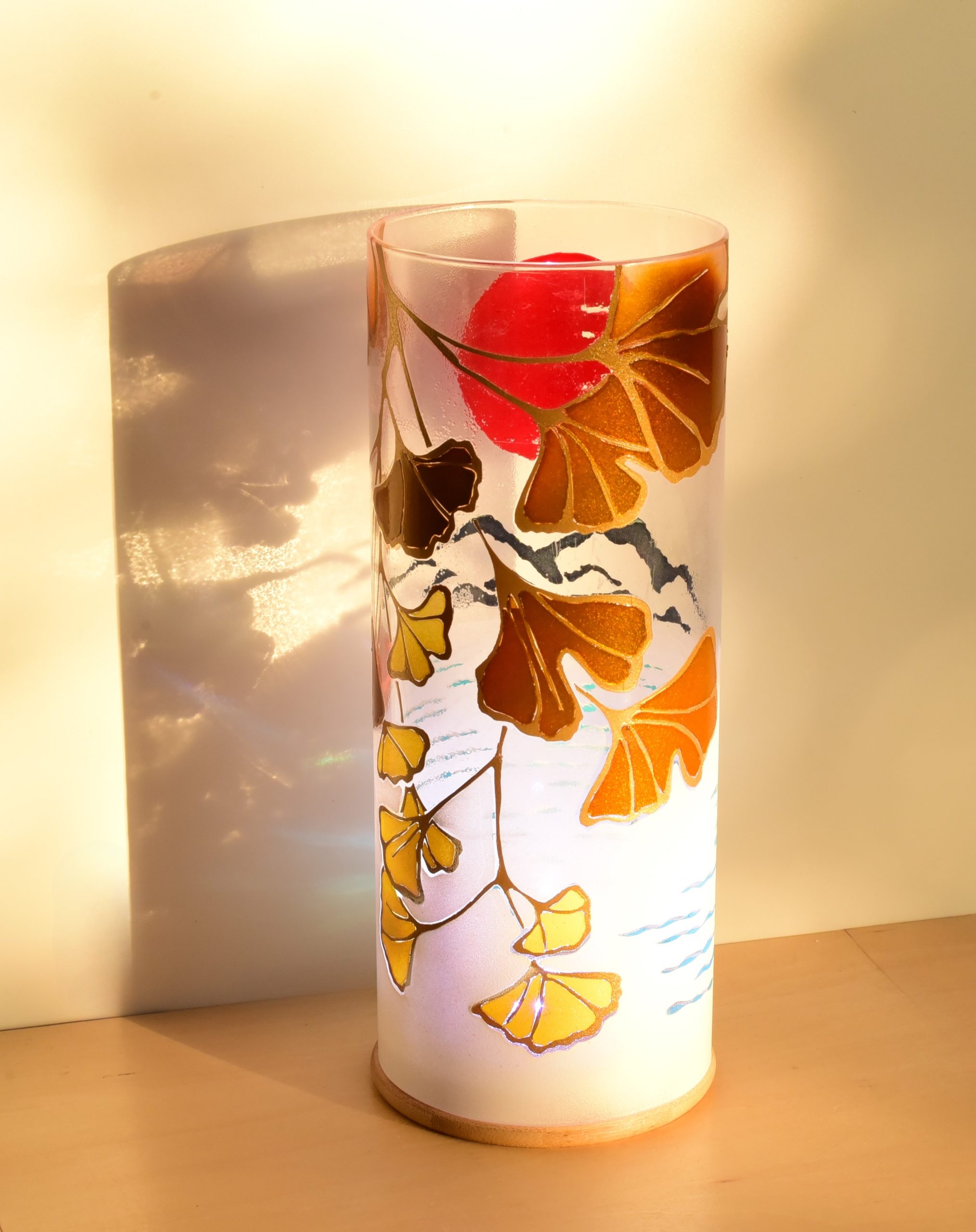 At sunrise, lit from only one side showing projected images on backdrop.