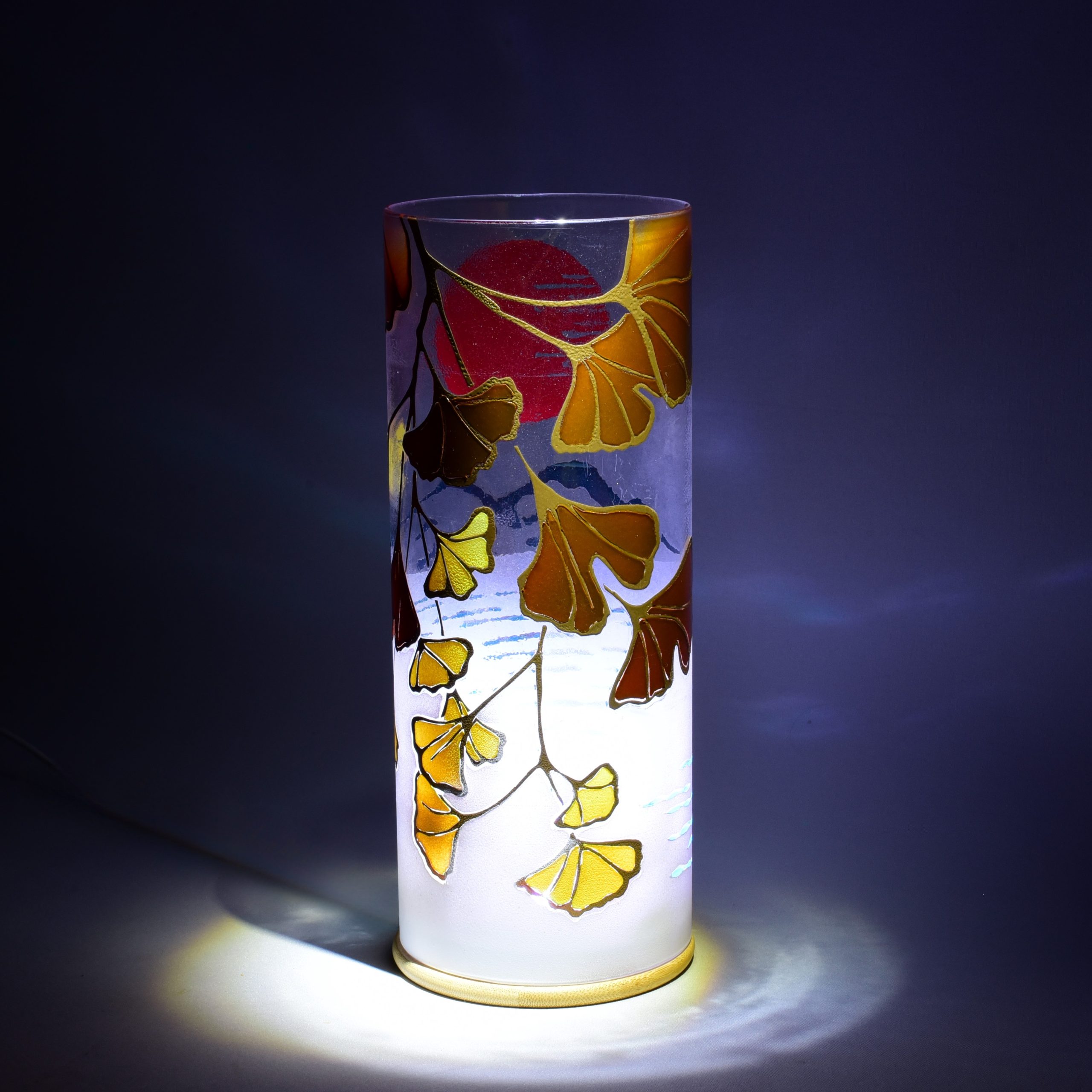 Unique accent lamp shown under spot light set directly overhead. Rear view.