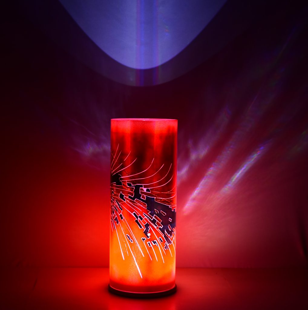 Accent lamp with only LED illuminated showing projected images on backdrop