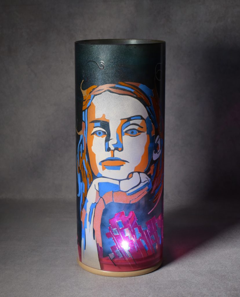 Accent lamp shown with only LED illuminated dramatically standing against a grey backdrop.