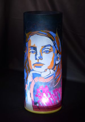 Unique accent lamp shown with internal LED on black velvet.