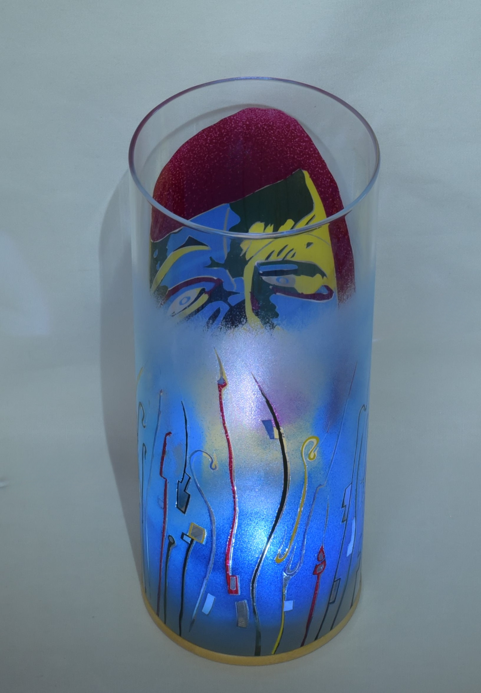 Displaying rear view through cylinder of glass.